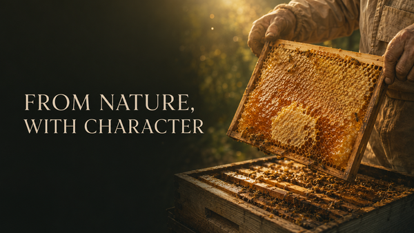 A jar of raw unfiltered honey with honeycomb showing natural purity