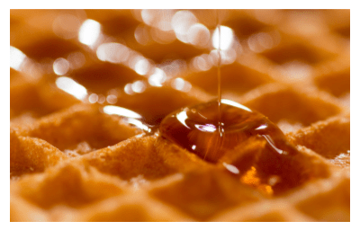 Honey dripping on waffle